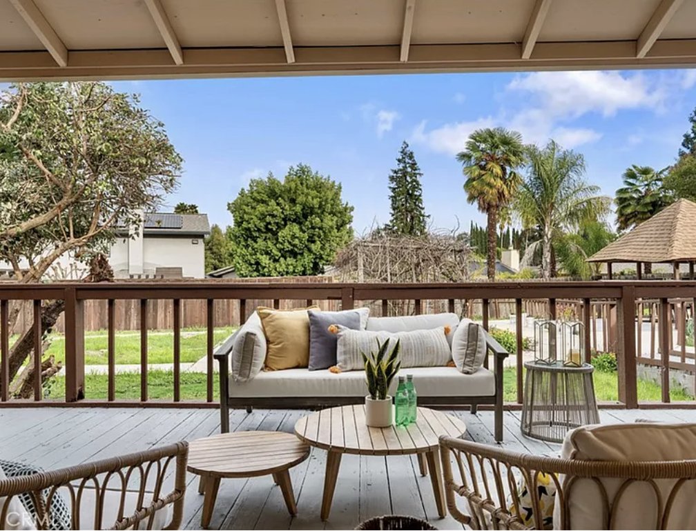 Covered deck with backyard view at the Danville residence