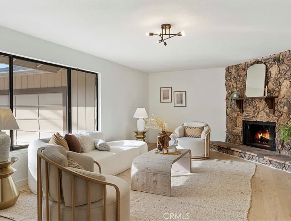 Living room with stone fireplace at the Danville residence